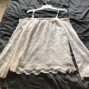A white lace off the shoulder shirt
